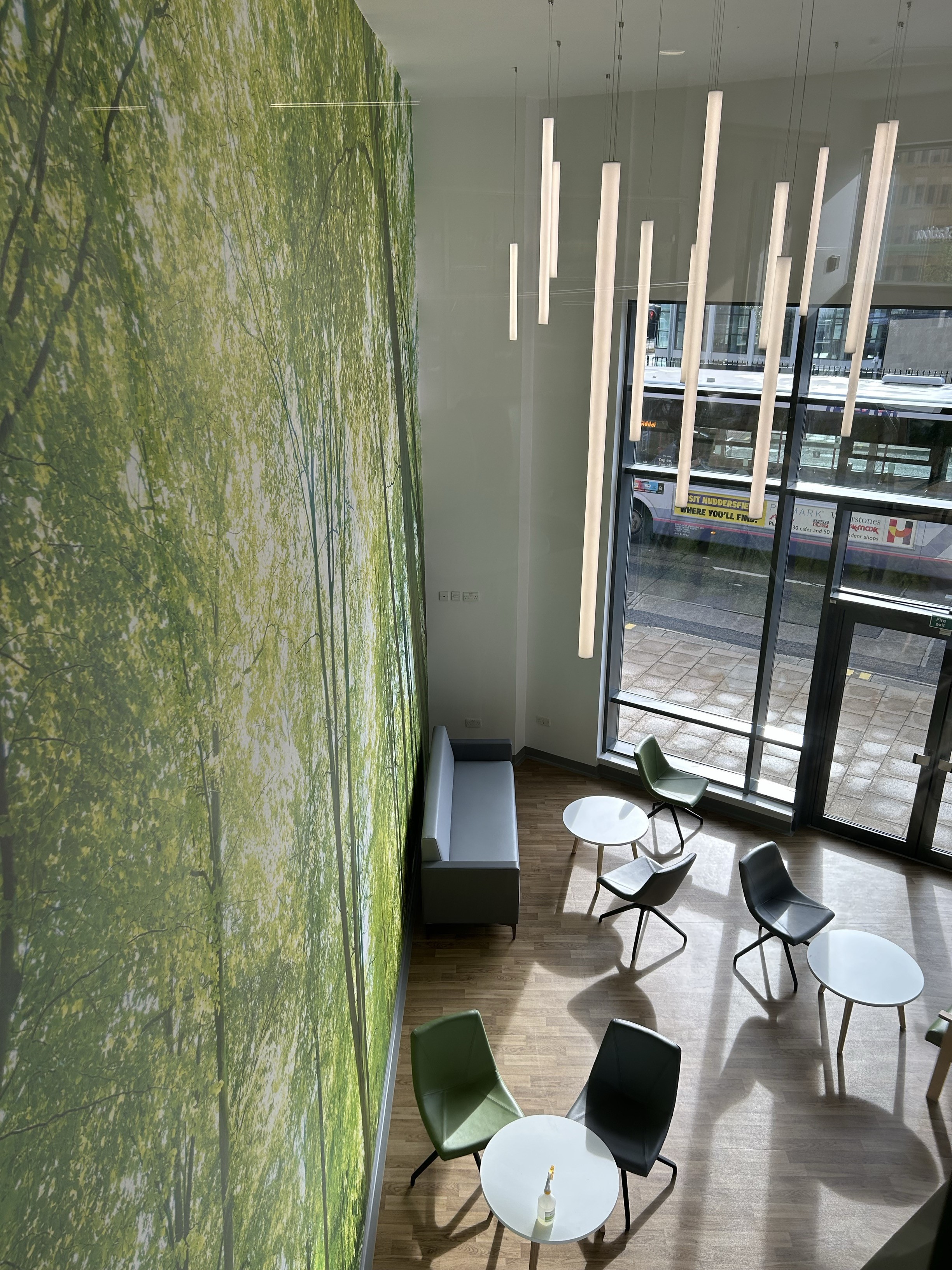 The main patient waiting room has green artwork on the walls