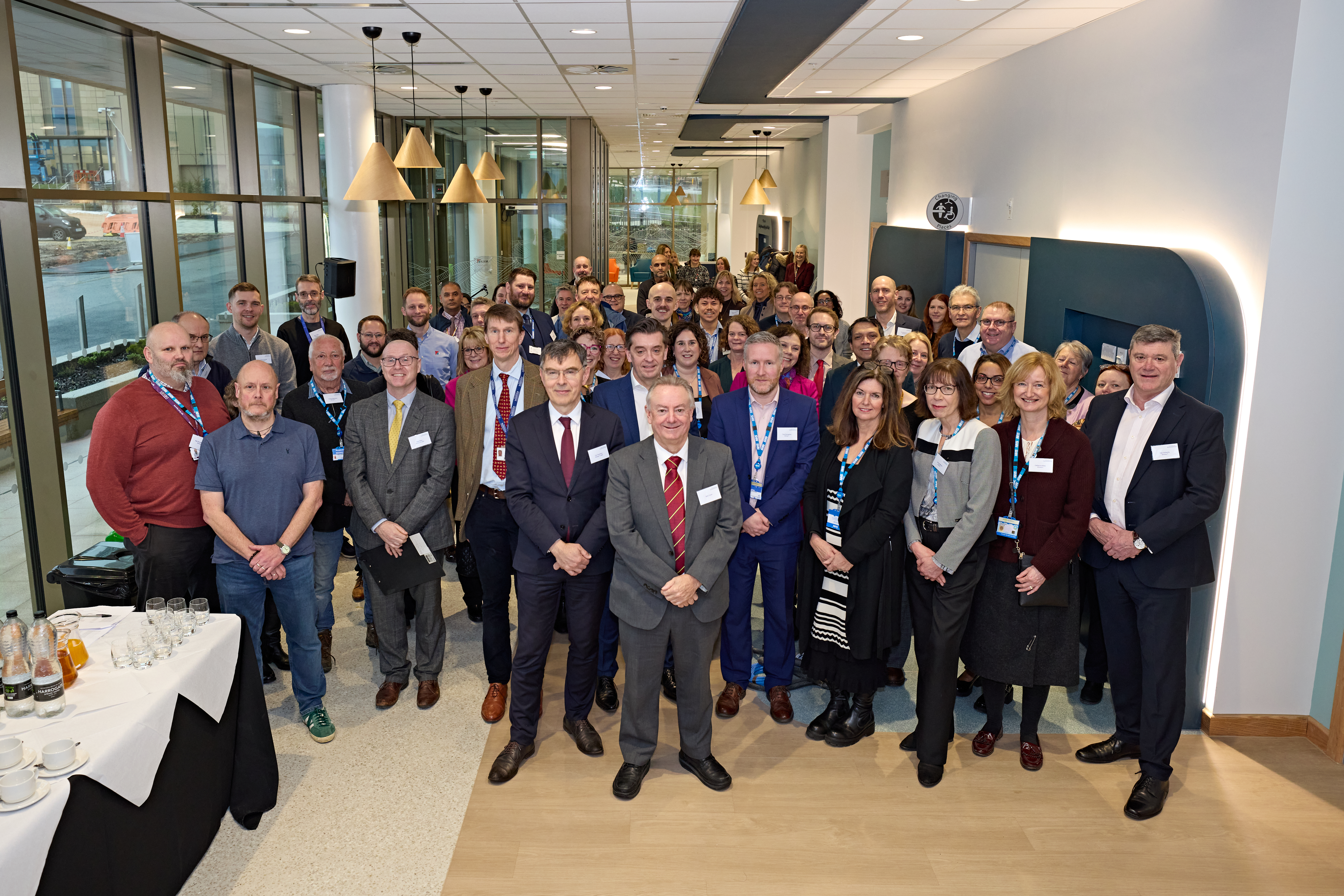 A group photo of colleagues from CHFT, The University of Huddersfield, Kier and invited guests in the CDC reception area, taken at the preview event