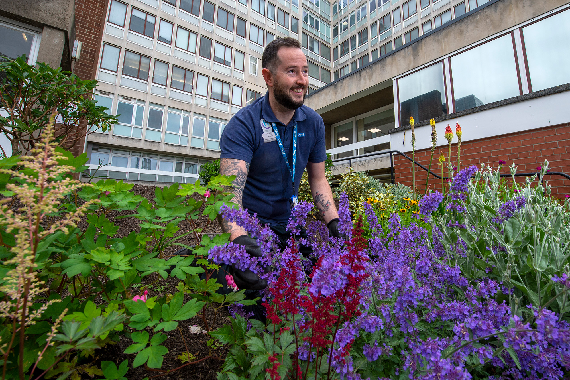 Male employee gardening