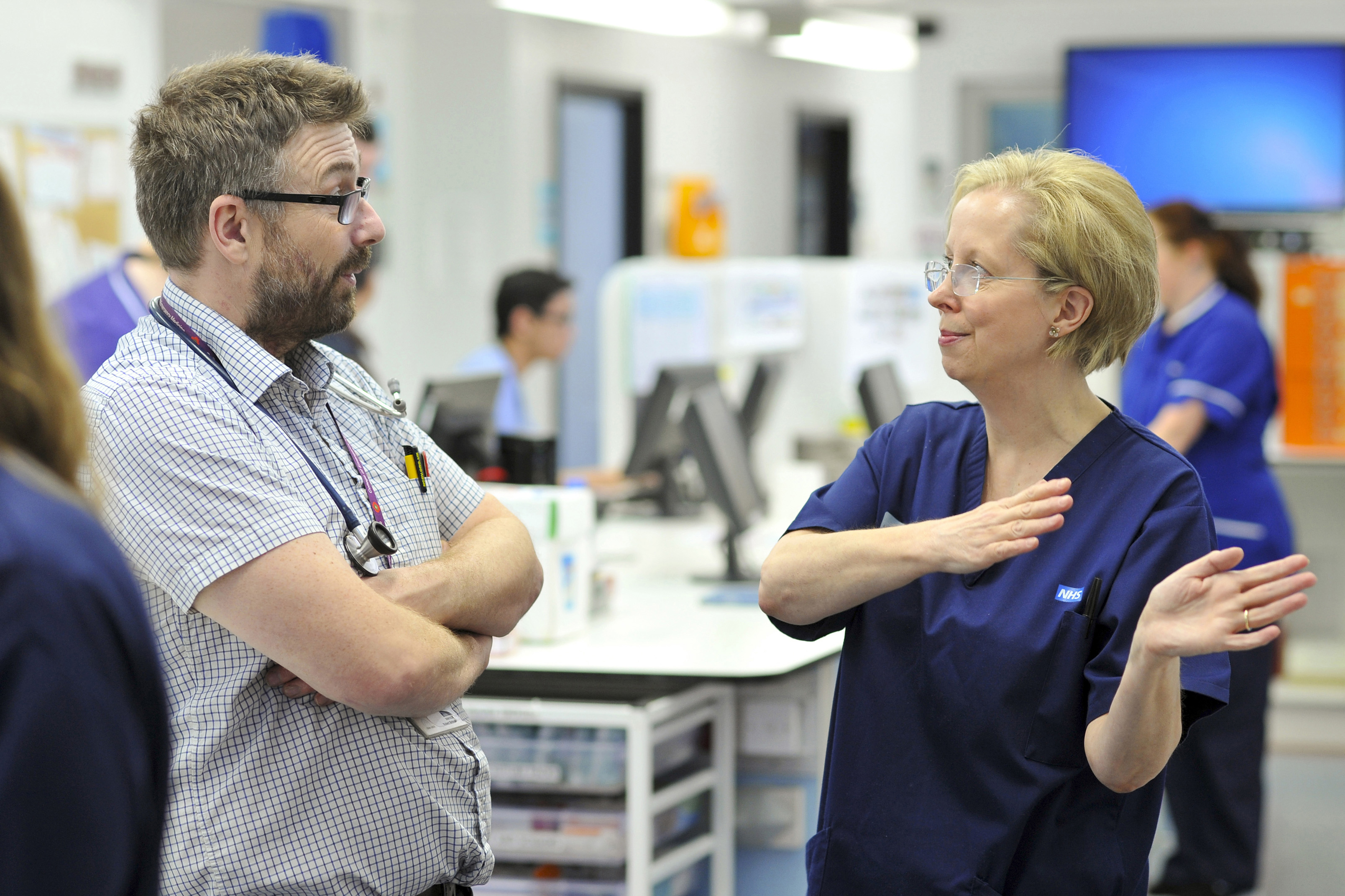 Two colleagues talking to each other