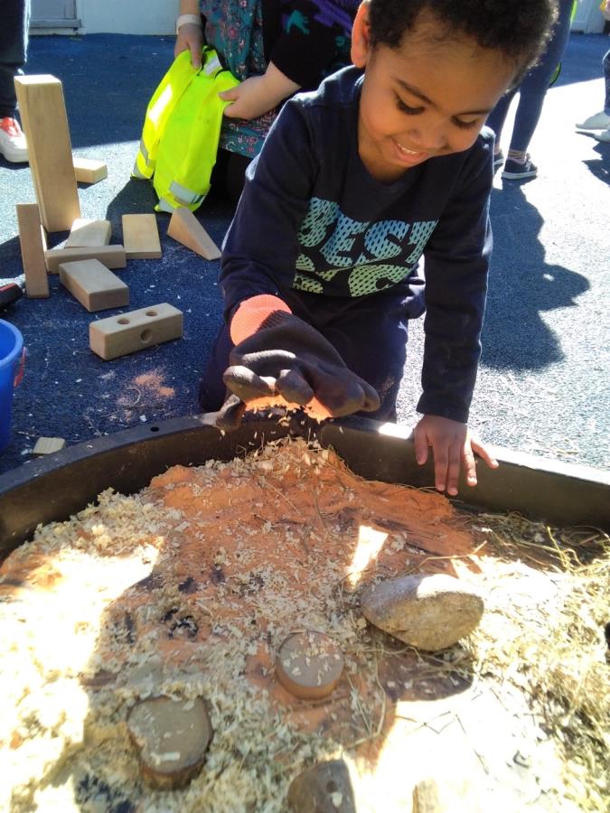 More fun as a child plays in a sandpit