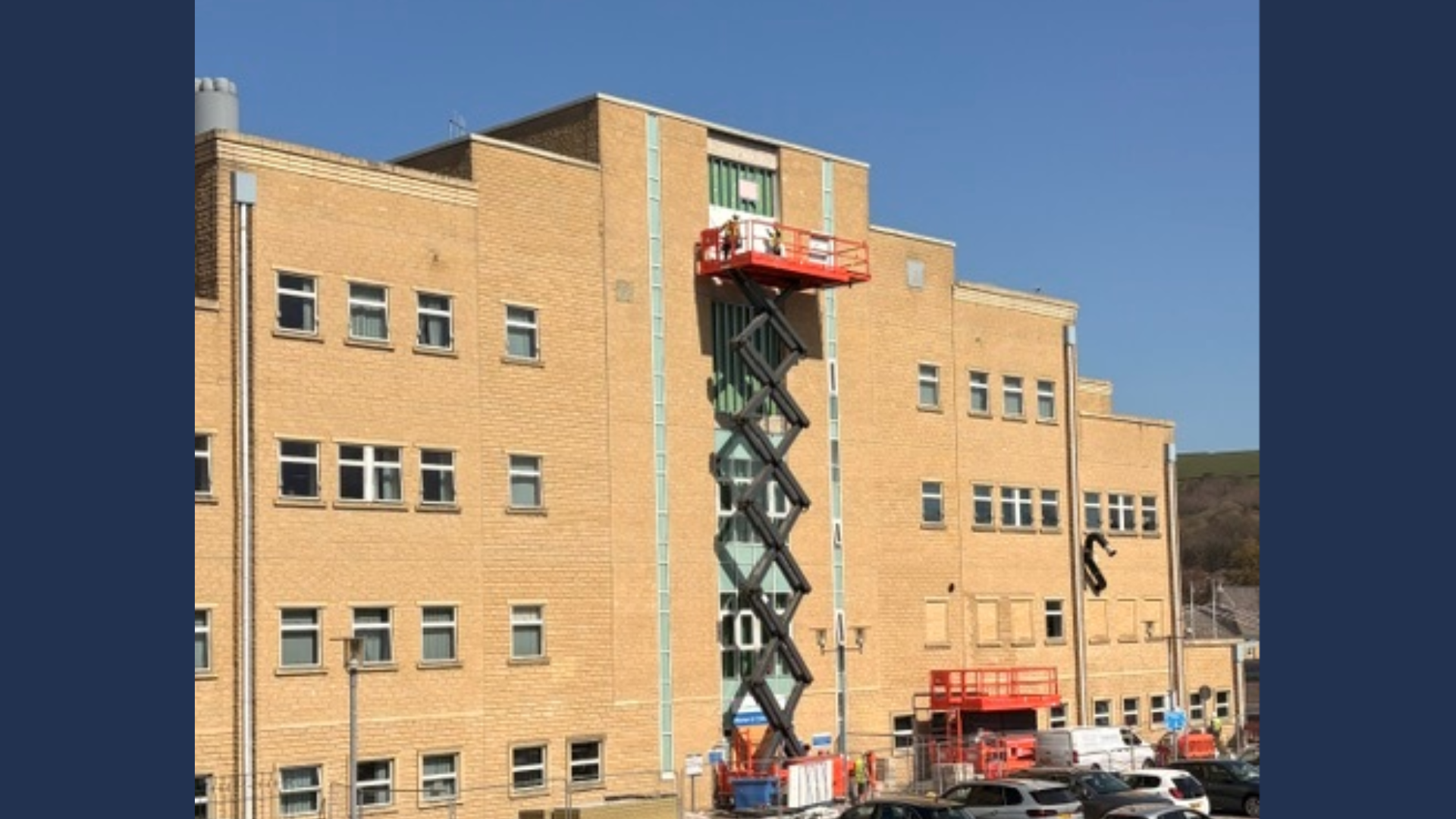 A photo of the scissor lift outside the Women and Children's Entrance