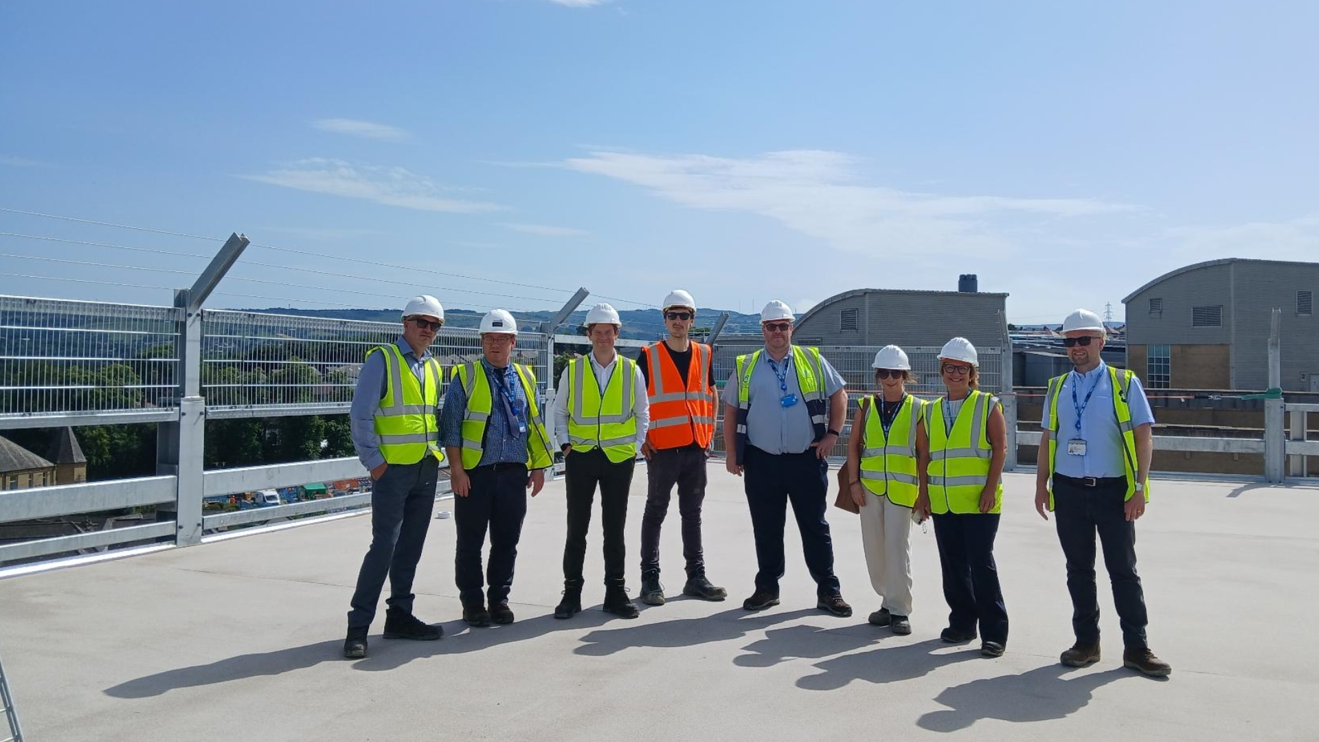 A group photo of people who have been involved in the project on the top floor of the multi-storey car park at CRH