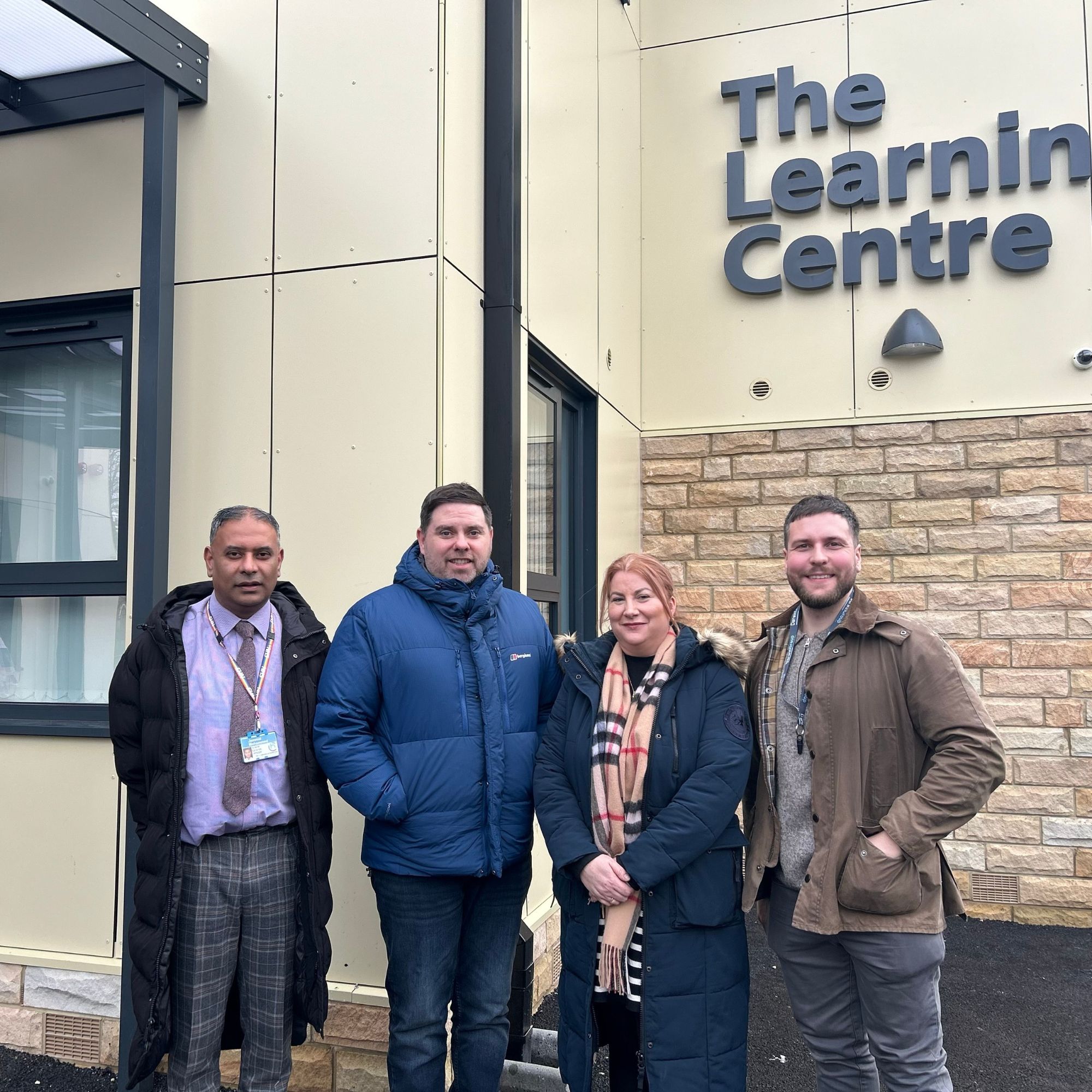 The handover team outside the new Learning Centre on handover day