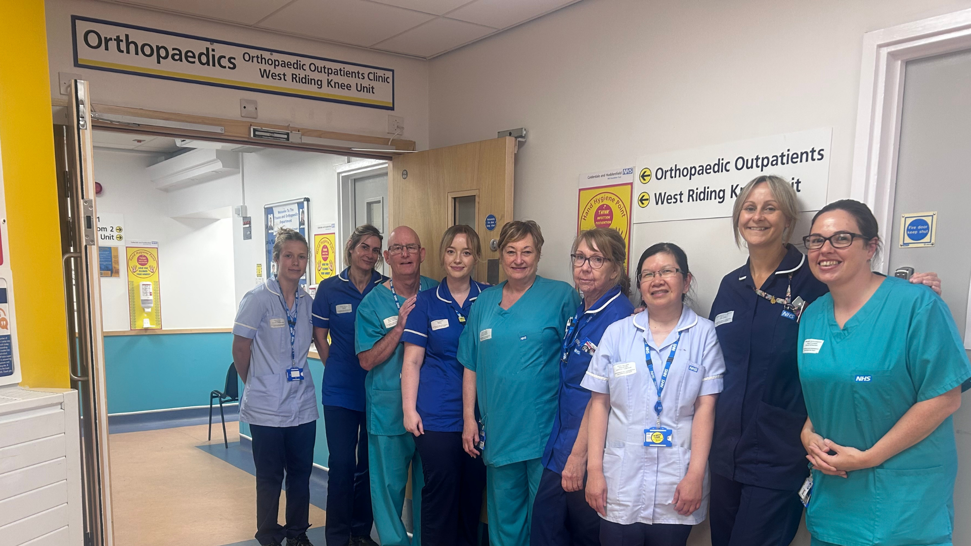 A photo of the Orthopaedic Outpatients team outside the department at HRI