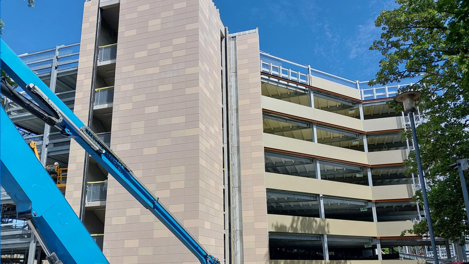 A photo which shows the completion of the terracotta tiles on the stairwells of the new multi-storey car park
