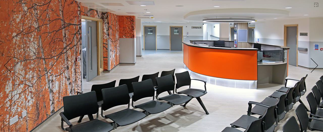 Reception and waiting area with black chairs