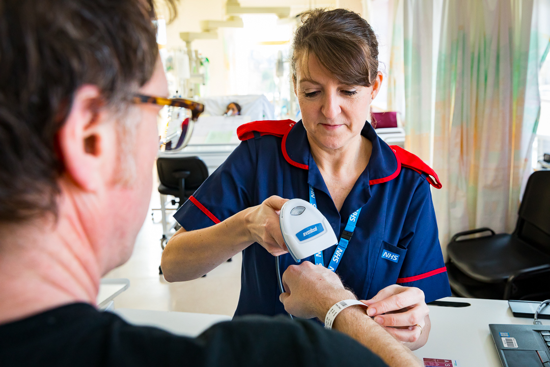 Nurse scanning barcode on patient wrist